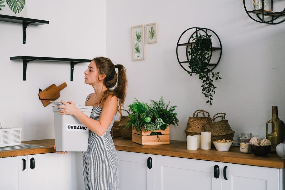 Modern kitchen with a stainless steel trash can beside the counter